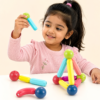 Young girl playing with the 25-piece Tukoy magnetic building sticks