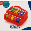 Red xylophone toy with coloured metal keys and two beaters