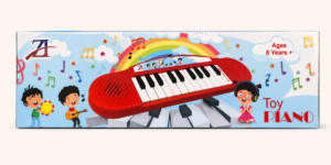 Red toy musical piano keyboard with rainbow artwork on the pack