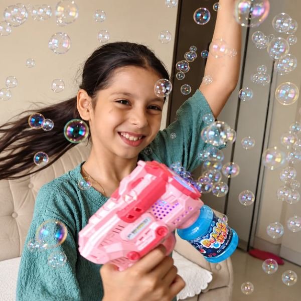 Urwa playing with a Tukoy bubble gun